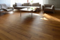 PARKIETT Salon z podłogami drewnianymi. Producent/Importer - Deska parkiet TEAK lity 15x90x300-1200 Olej Lakier Warszawa